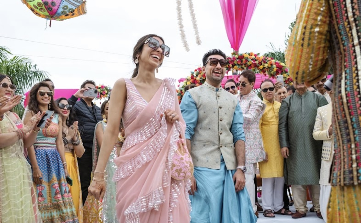 A joyful couple surrounded by wedding guests